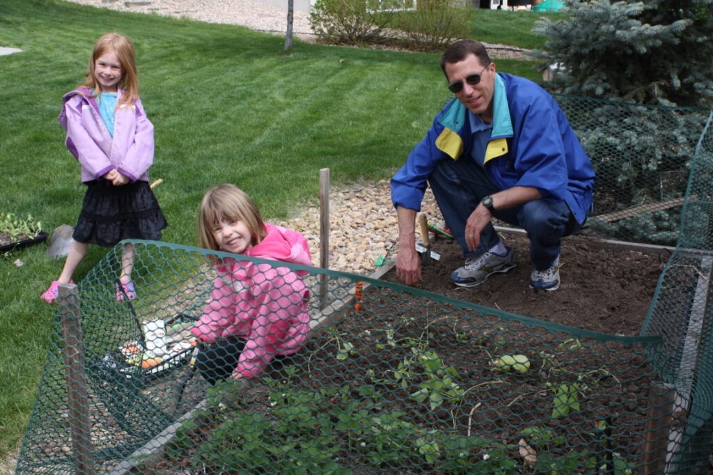 Spring Time! Dad and 2 daughters gardening