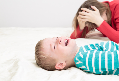 child is crying while mother at wits end - difficult parenting