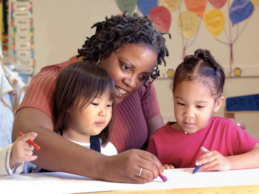 mom or teacher with two children