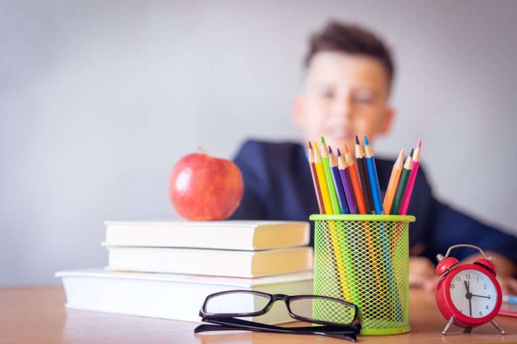 Boy sitting at organized desk