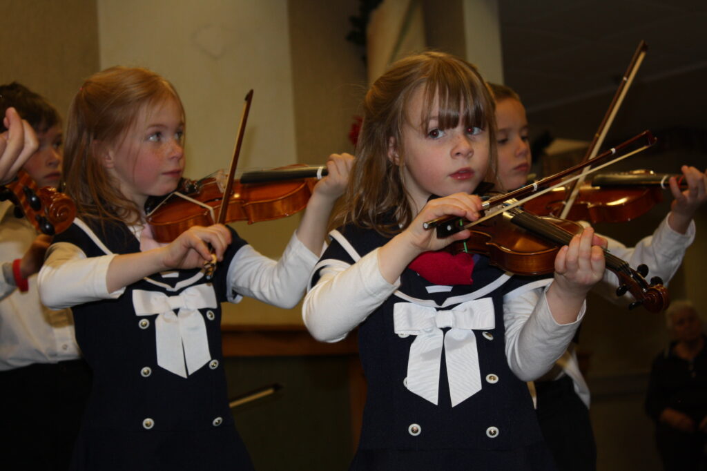 girls playing musical instruments