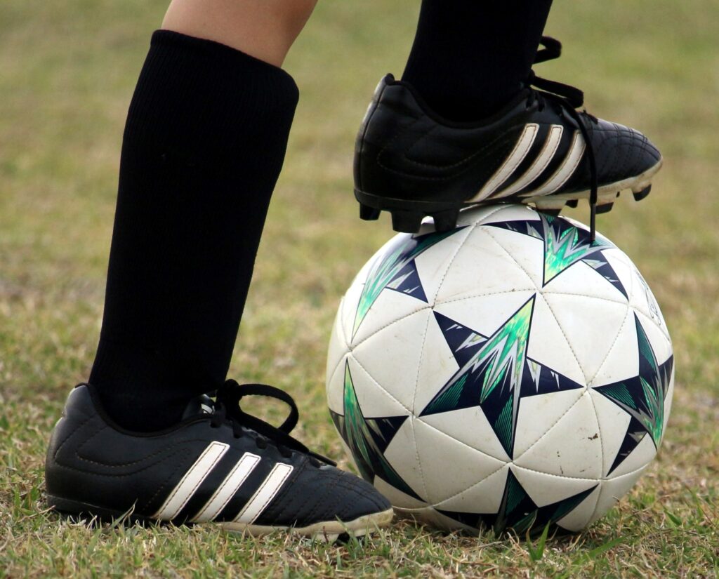 cleats and soccer ball