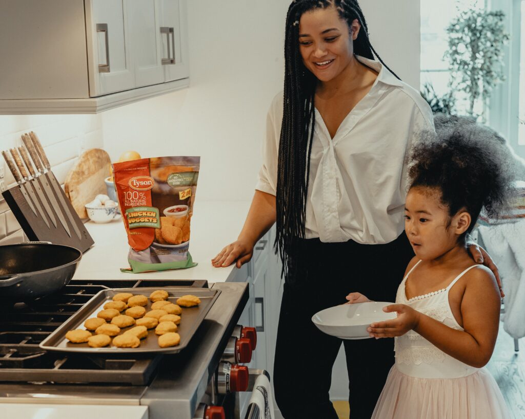 A mother and daughter baking together